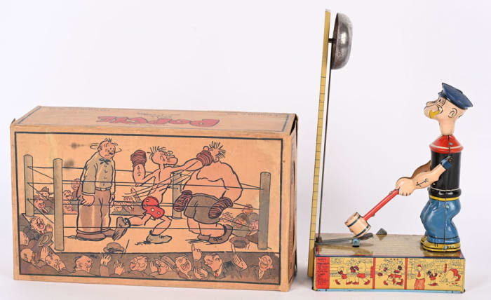 Rare Chein tin wind-up Popeye Heavy Hitter, 11-1/2", all original, in working order, and complete with original box; estimate: $5,000-$6,000.